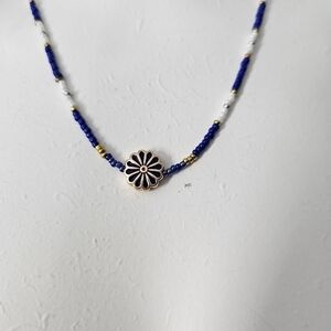 Charming beaded necklace with gold plated chain and charming daisy bead Handmade